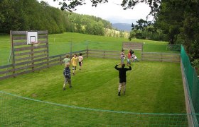 Playing soccer on the green meadow., © Ofnerhof