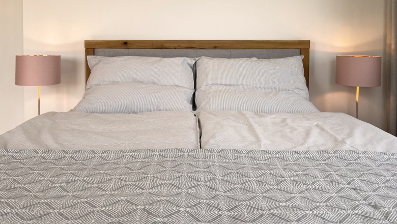 Box spring bed in bedroom 1, © Kay Haderer